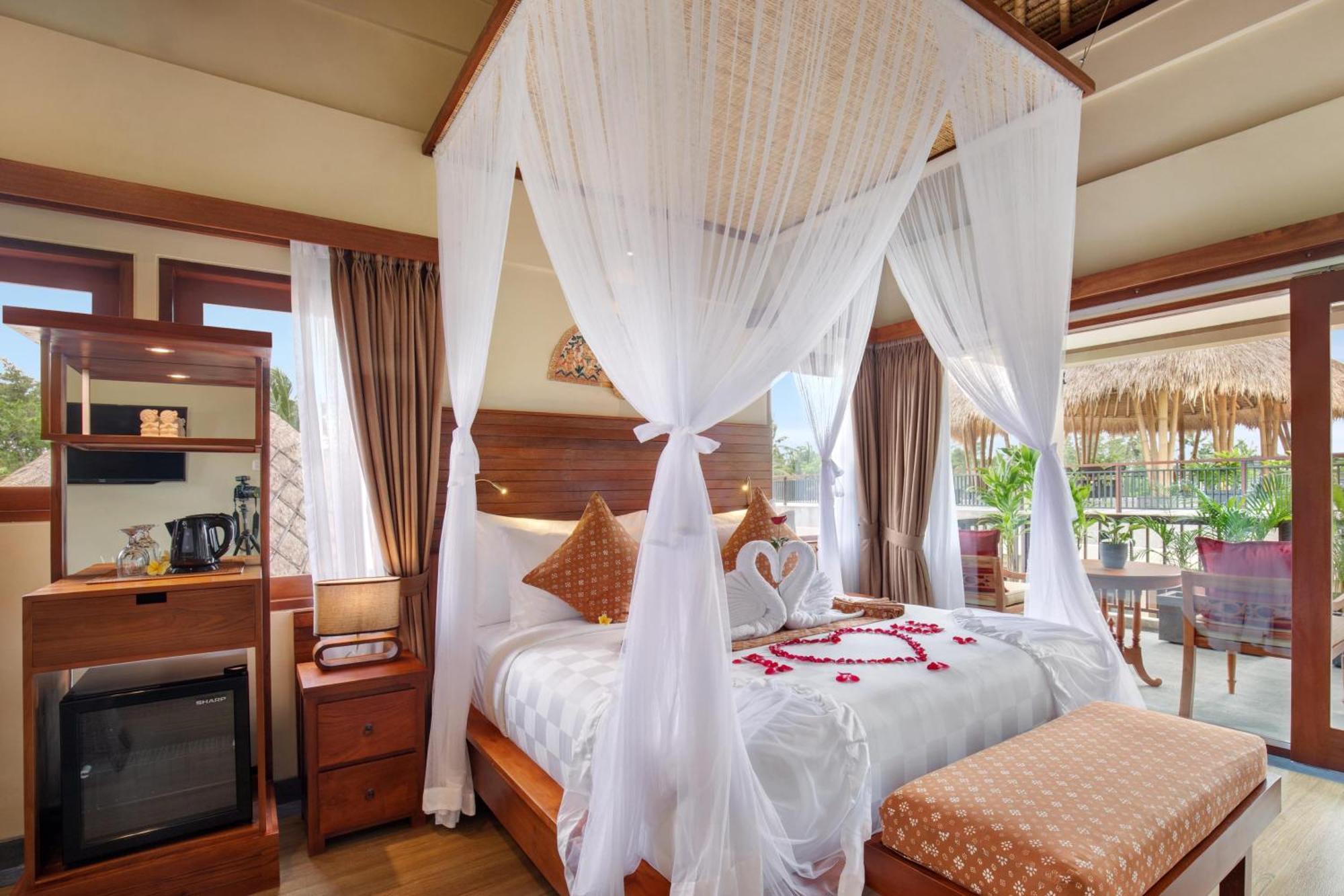 Ubud Nyuh Bali Resort & Spa Номер фото A canopy bed